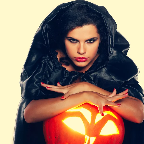 Sexual brunette in the suit of witch in night of Halloween Stock Image