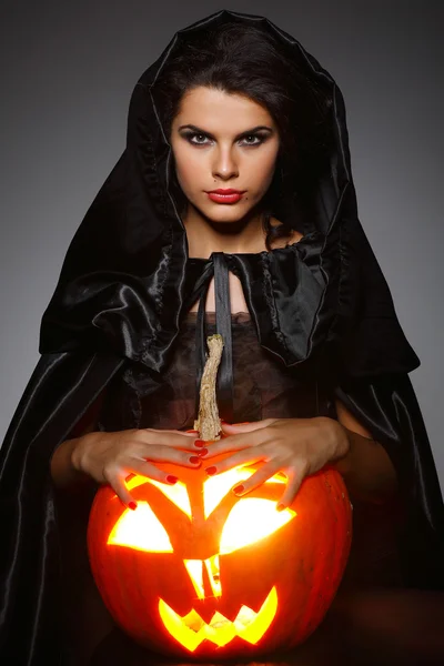 Sexual brunette in the suit of witch in night of Halloween Royalty Free Stock Images