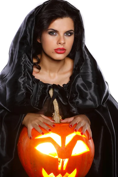 Sexual brunette in the suit of witch in night of Halloween Stock Picture