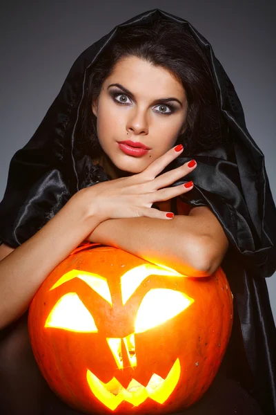 Sexual brunette in the suit of witch in night of Halloween Royalty Free Stock Photos