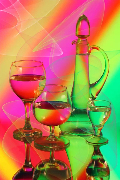 Three wineglasses and a jug — Stock Photo, Image