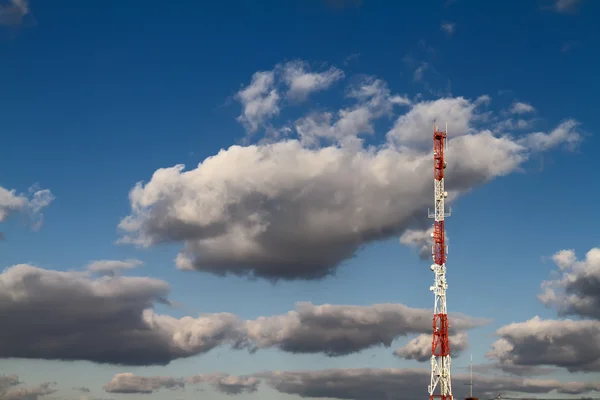 stock image Telecommunication tower, clouds and blue sky