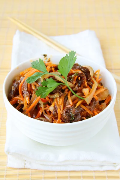 Asian style salad with carrots, meat and chili peppers — Stock Photo, Image