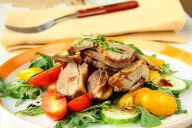 Salad with duck breast, cherry tomatoes and arugula clipart