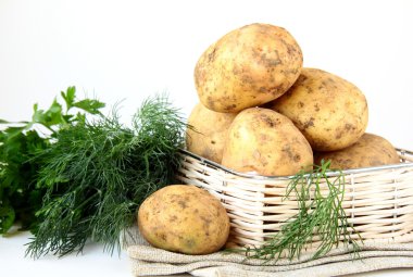 Basket of fresh organic potatoes clipart