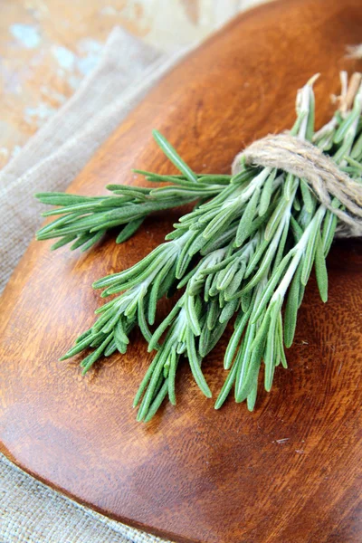 Rosemary bound on a wooden table — Stock Photo, Image