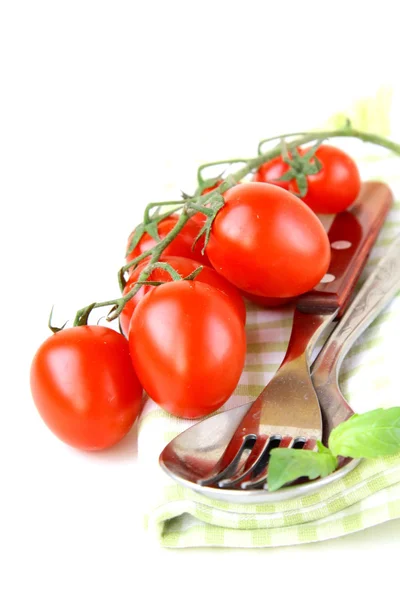 Tomates cereja frescos em prato, colher e garfo — Fotografia de Stock