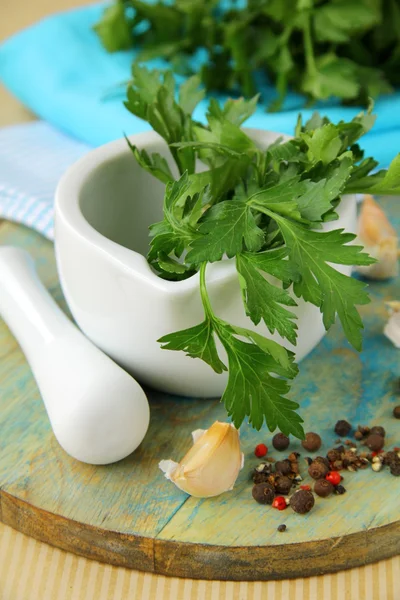 stock image Green parsley in a mortar with garlic and pepper