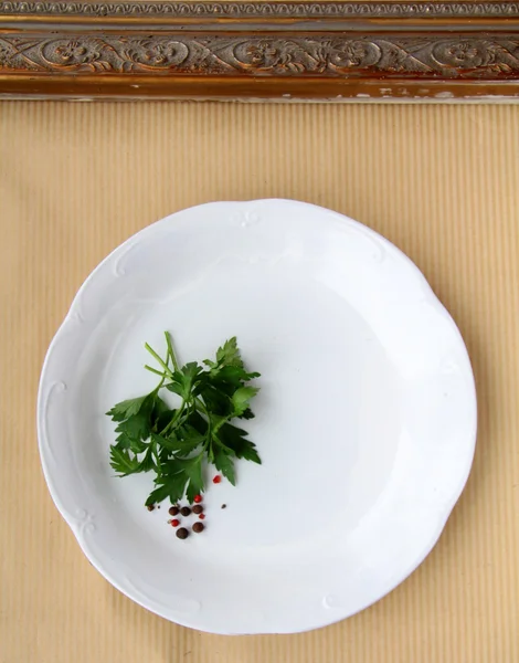 Plates with sprig of parsley - organic menu — Stock Photo, Image