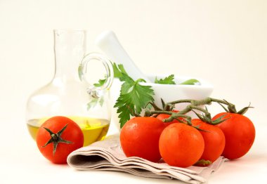 Fresh ripe tomatoes with basil and olive oil clipart