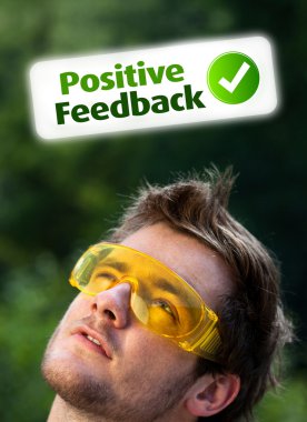 Young head looking at positive negative signs clipart