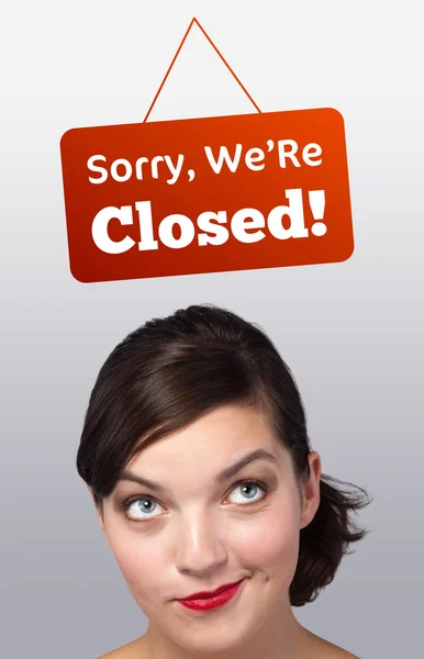 Young girl head looking at closed and open signs — Stock Photo, Image