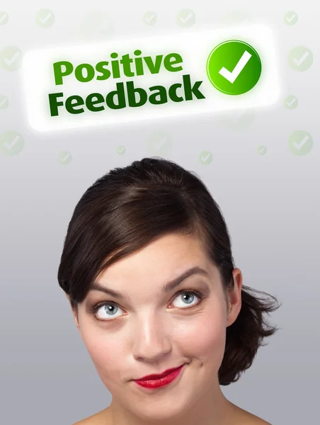 Young girl looking at positive negative signs — Stock Photo, Image