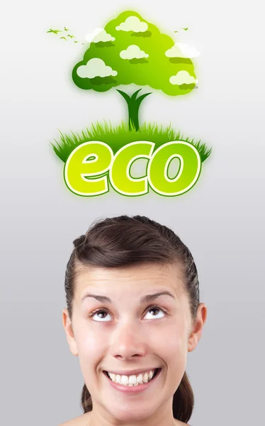 Young girl looking at green eco sign — Stock Photo, Image