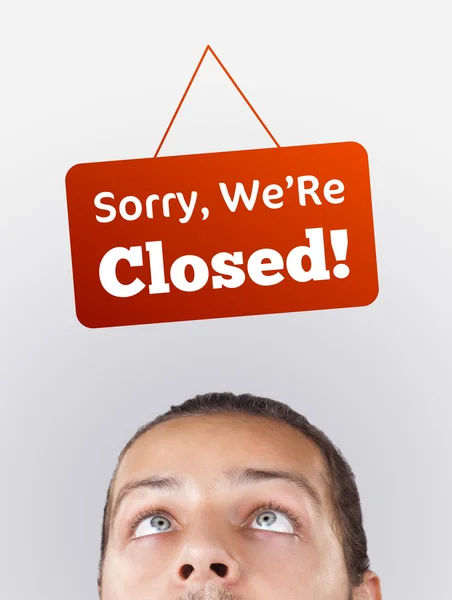 Young persons head looking at closed and open signs — Stock Photo, Image