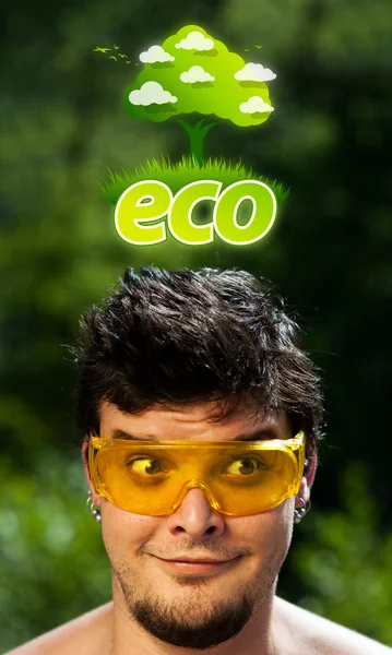 Jeune tête regardant signe vert eco — Photo