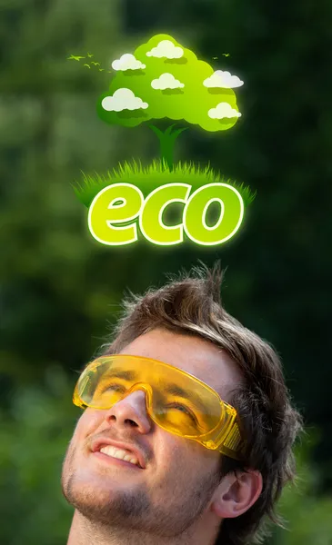 Cabeza joven mirando verde eco signo — Foto de Stock