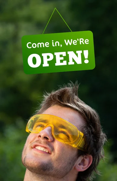 Young persons head looking at closed and open signs — Stock Photo, Image