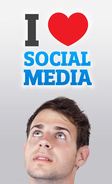 Unga huvud titta på sociala typ av ikoner och skyltar — Stockfoto