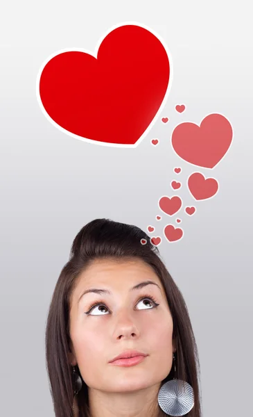 Ung tjej söker kärlek typ av ikoner — Stockfoto