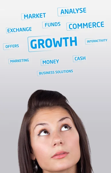 Молодая девушка голову глядя на бизнес-иконы и образы — стоковое фото