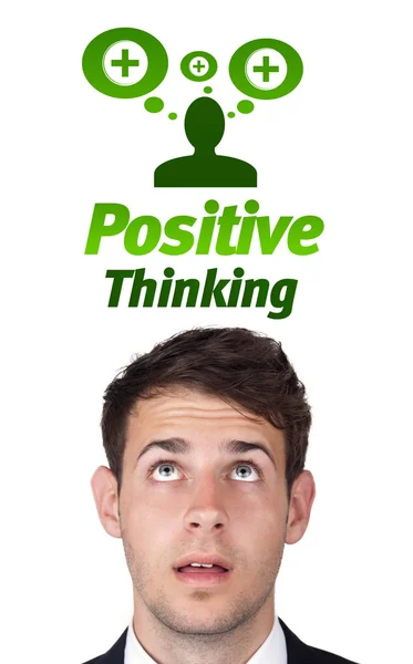 Young head looking at positive negative signs — Stock Photo, Image
