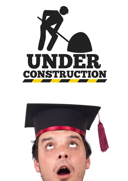 Young head looking at contruction icons — Stock Photo, Image