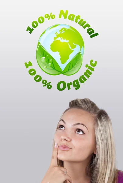 Young girl looking at green eco sign — Stock Photo, Image