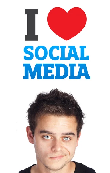 Молодой человек смотрит на социальный тип икон и знаков — стоковое фото