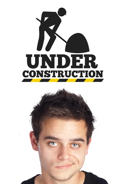 Young head looking at contruction icons — Stock Photo, Image