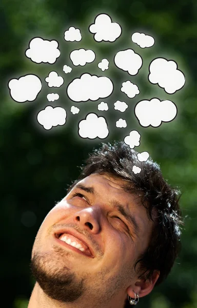 Young head thinking with clouds — Stock Photo, Image