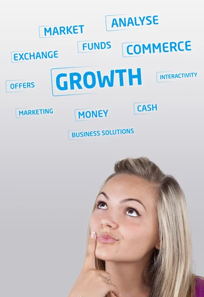Young girl head looking at business icons and images — Stock Photo, Image