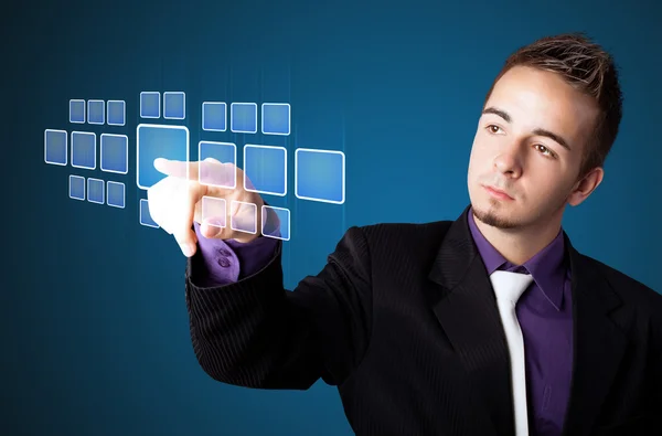 Businessman pressing high tech type of modern buttons — Stock Photo, Image