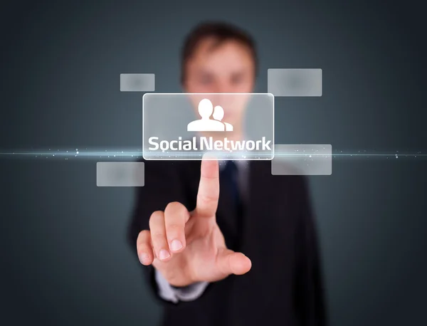 Businessman pressing modern social type of icons — Stock Photo, Image