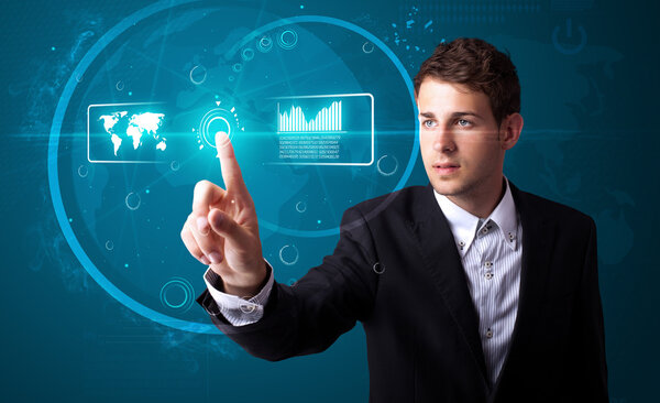 Businessman pressing high tech type of modern buttons