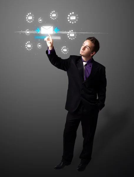 Businessman pressing virtual messaging type of icons — Stock Photo, Image