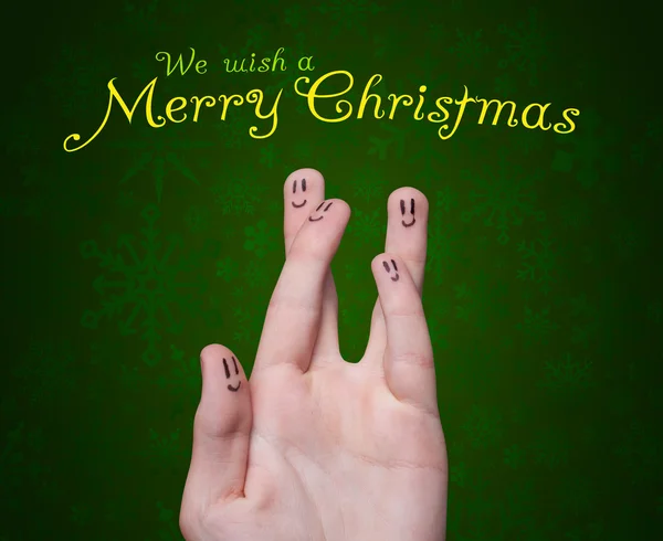 Happy group of finger smileys with merry christmas sign — Stock Photo, Image