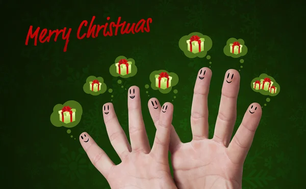 Happy group of finger smileys with merry christmas sign and pres — Stock Photo, Image
