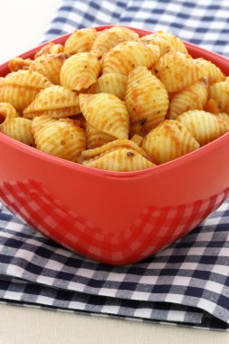 Delicious pasta shells with fresh marinara sauce clipart