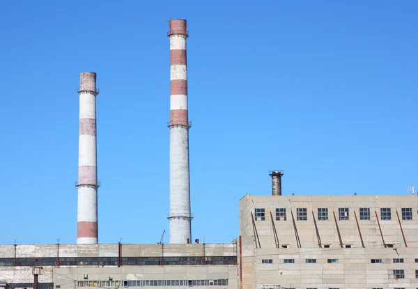 stock image Chimneys large plant against the blue sky