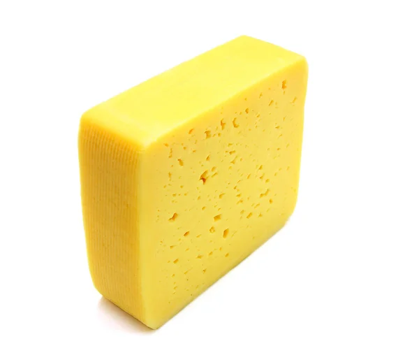 Beyaz arka planda izole edilmiş bir peynir parçası — Stok fotoğraf