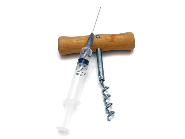 Syringe and corkscrew — Stock Photo, Image
