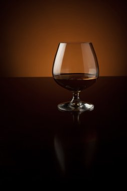 Glass of luxury cognac with copy space clipart