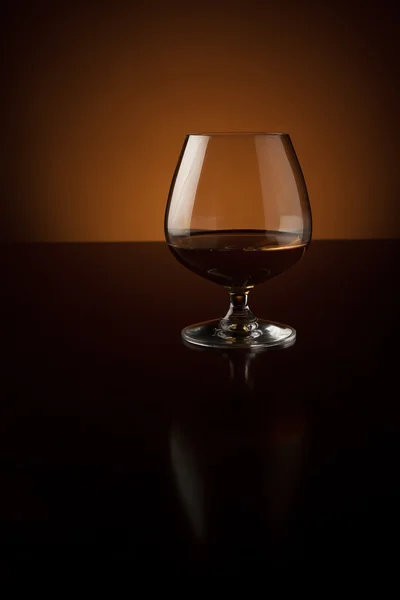 Glass of luxury cognac with copy space — Stock Photo, Image