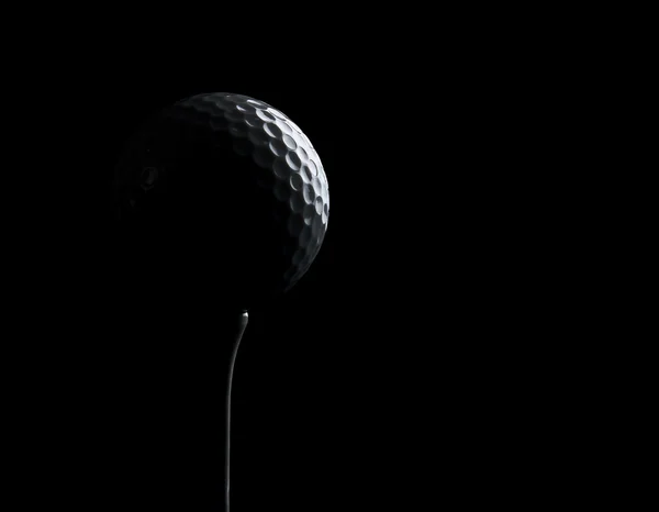 Silhouette of a golf ball on a tee, with copy space — Stock Photo, Image