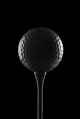 Silhouette of a golf ball on a tee, with copy space clipart