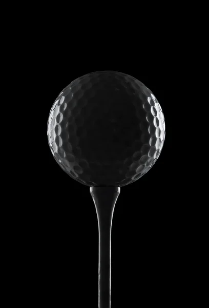 Silhueta de uma bola de golfe em um tee, com espaço de cópia — Fotografia de Stock