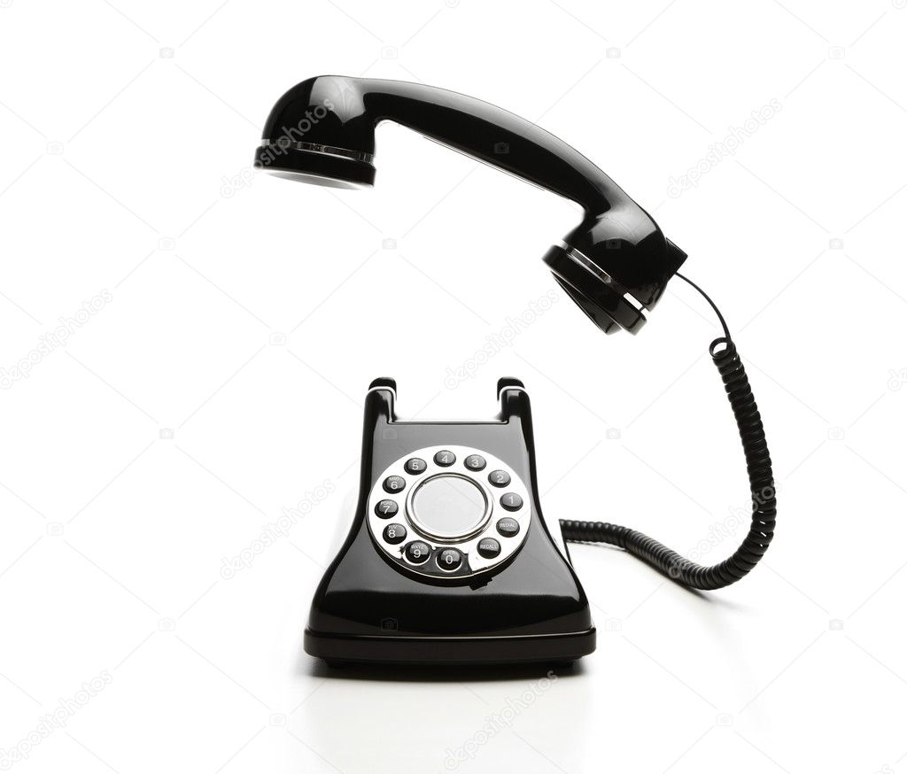 Old fashioned telephone on white background