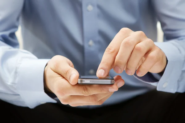 Close up of a man using smartphone — Stock Photo, Image