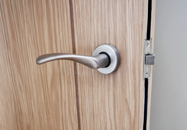 Modern shaped door handle — Stock Photo, Image